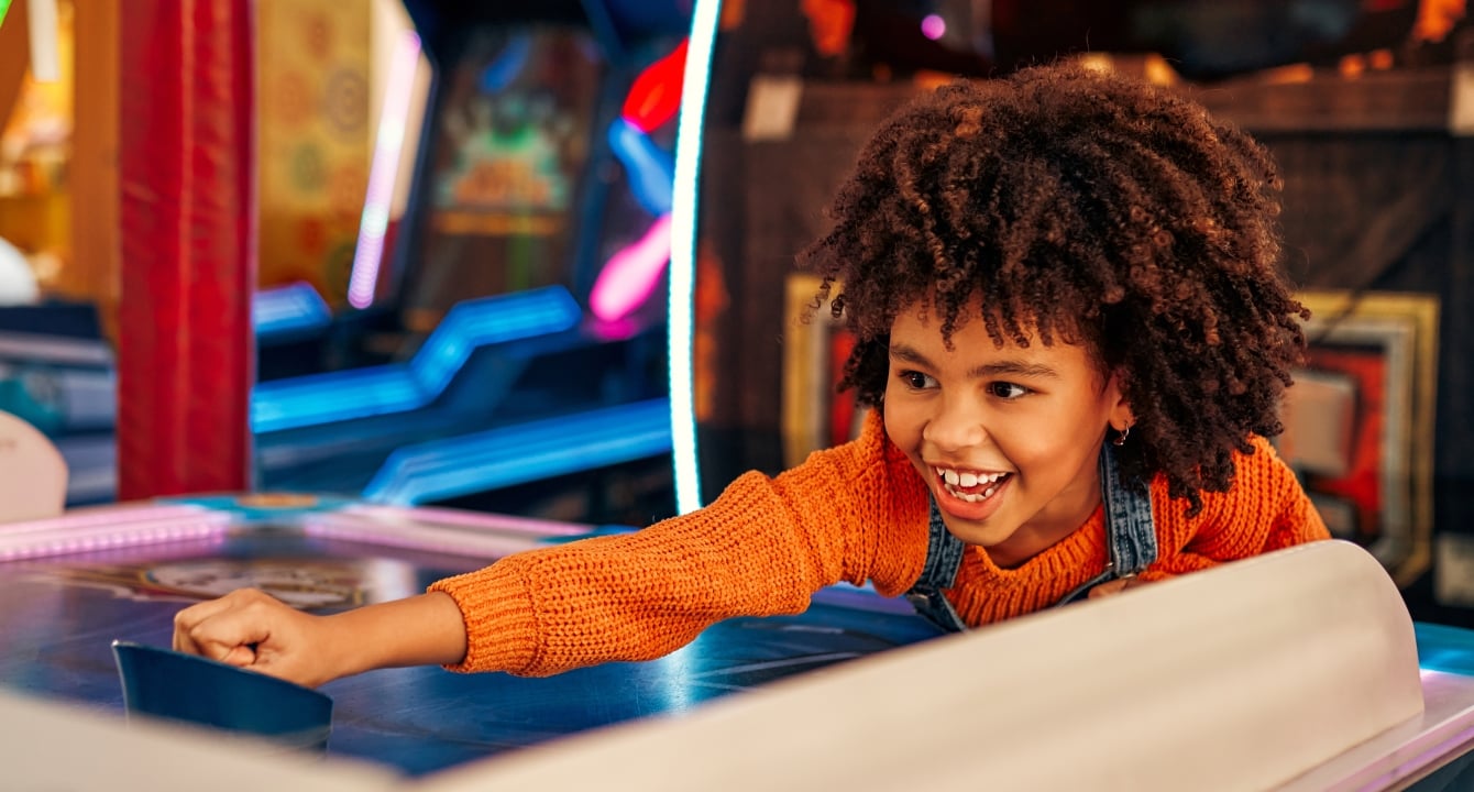 A child playing in an arcade at Horseshoe Bay Resort