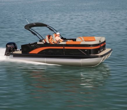 a man and woman enjoying a pontoon ride at horseshoe bay resort