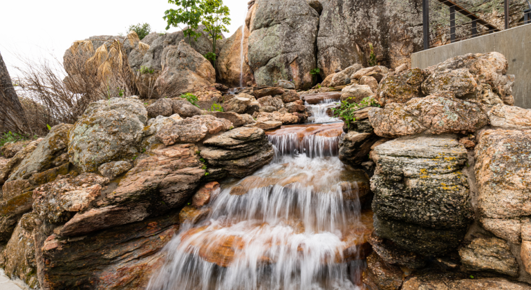 close up view of water flowing from a waterfall at the cap rock cabana at horseshoe bay resort