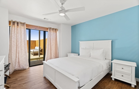 single bed in a bedroom at horseshoe bay resort with a fenced off seating area