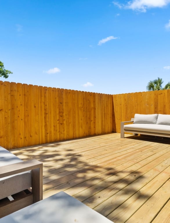 outdoor seating area with chairs in a fenced off area at horseshoe bay resort