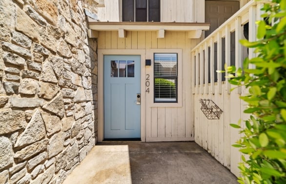 exterior view of the entrance to a condo available for rent at horseshoe bay resort