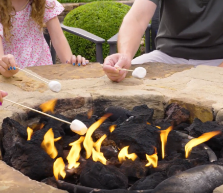 people roasting marshmallows over a fire at horseshoe bay resort