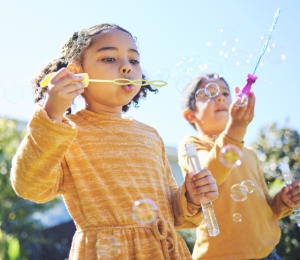 two kids playing with bubbles at horseshoe bay resort