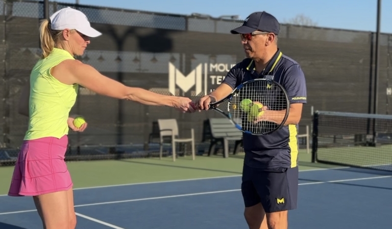 A student and instructor at the Adult Weekend Tennis Camp at Horseshoe Bay Resort